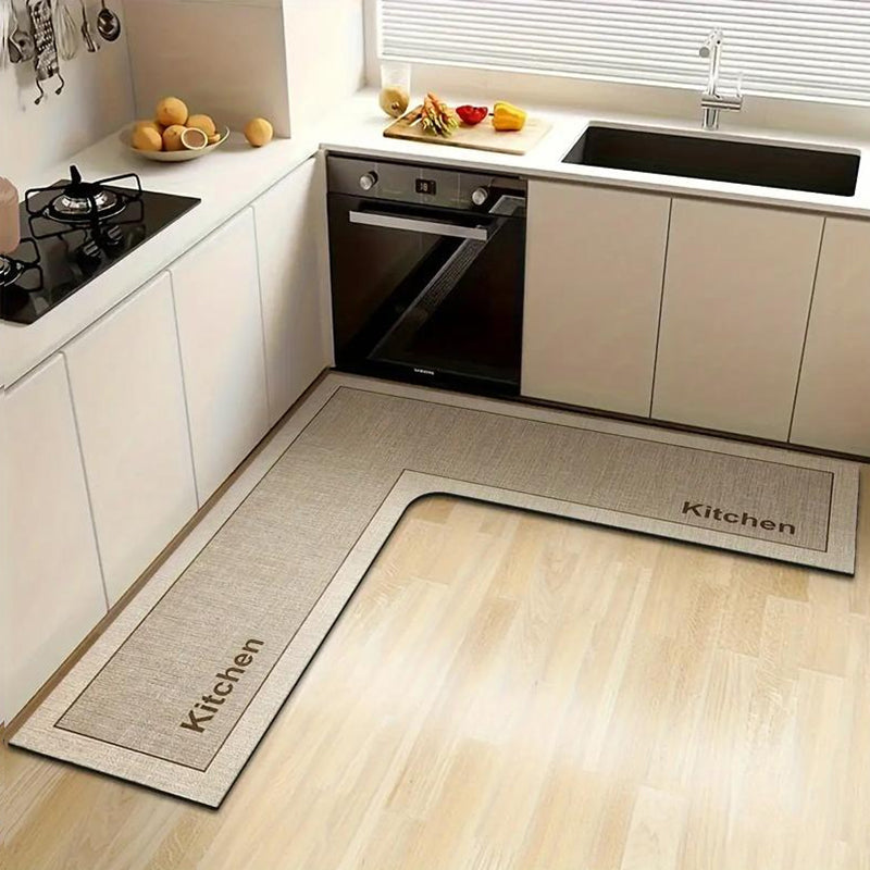 💧 Stop slipping on wet kitchen floors — this L-shaped mat absorbs water and oil fast, stays put, and cushions your feet while you cook. 🏠